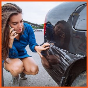 CPI - Woman Looking at Car Scratches