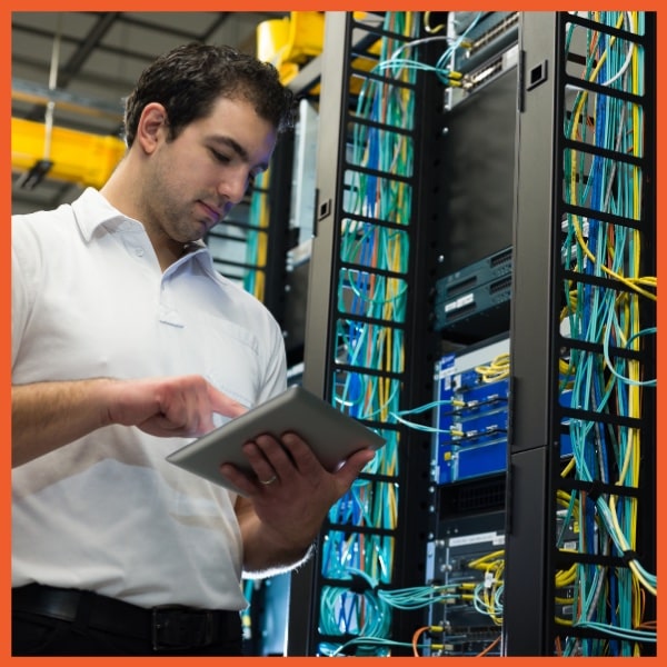 Equipment Management System - Man Working in Server Room